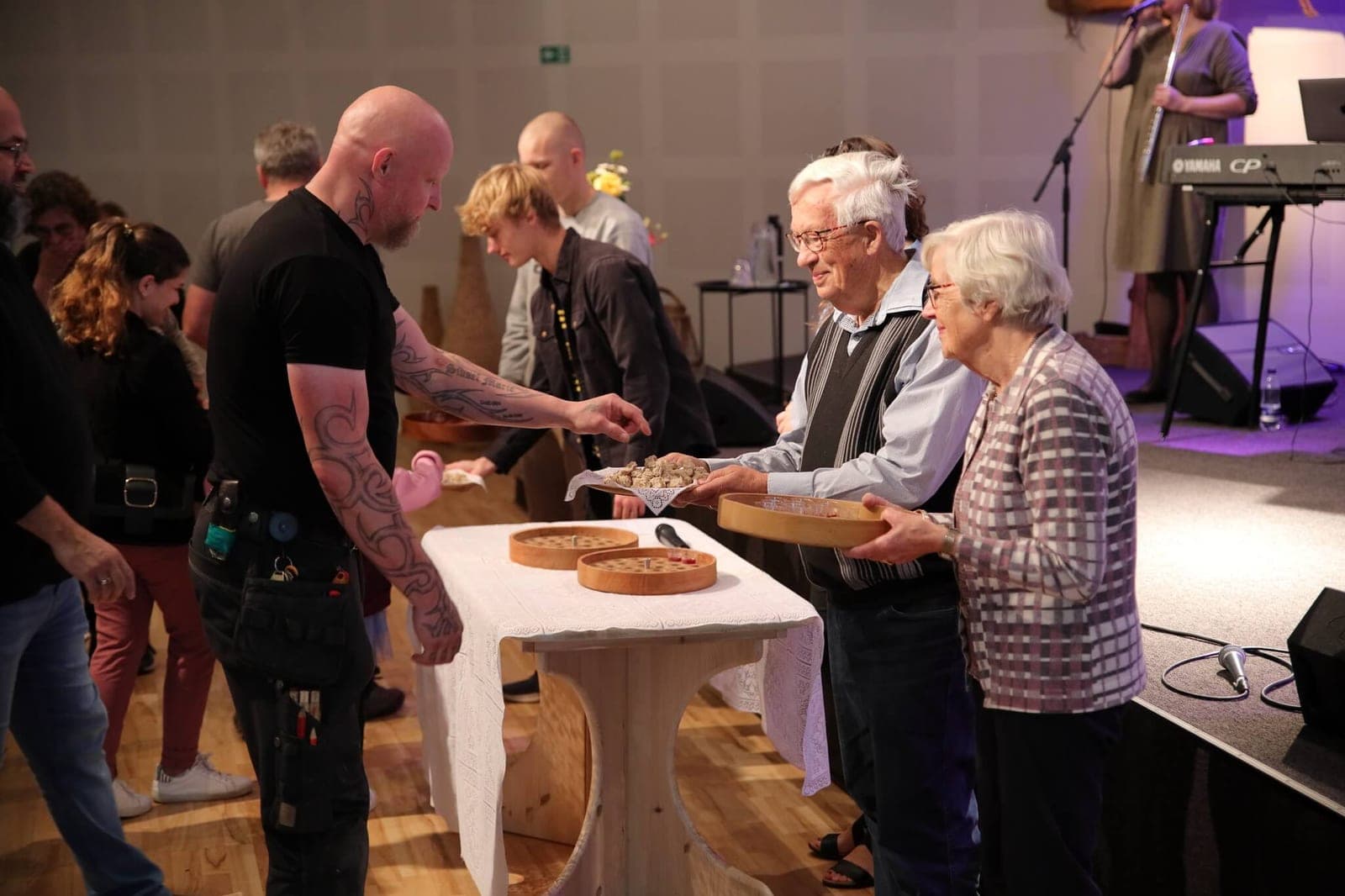 Bread and cups being shared at the communion table during the service